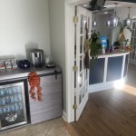 Mini fridge and bar next to front desk